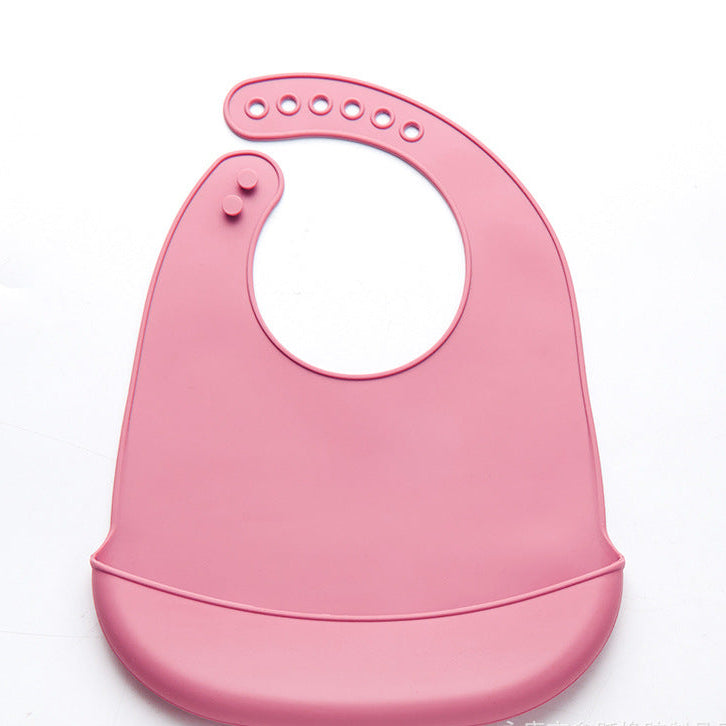 Bavoir rose en silicone avec récupérateur