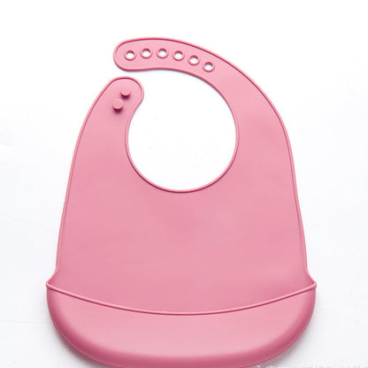 Bavoir rose en silicone avec récupérateur