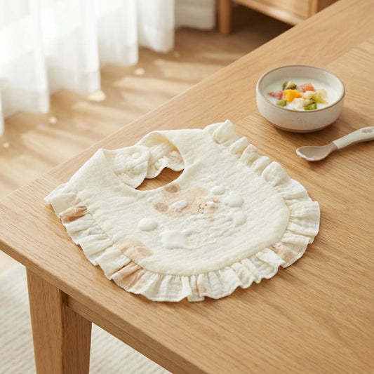 Le bavoir doux en coton 